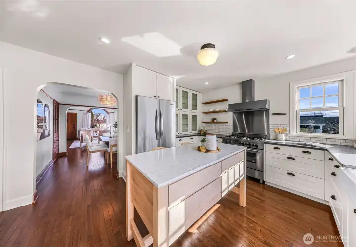 Kitchen features subway tile, quartz counters and stainless high end appliances.