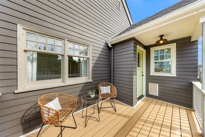 Back sunny composite deck off kitchen.