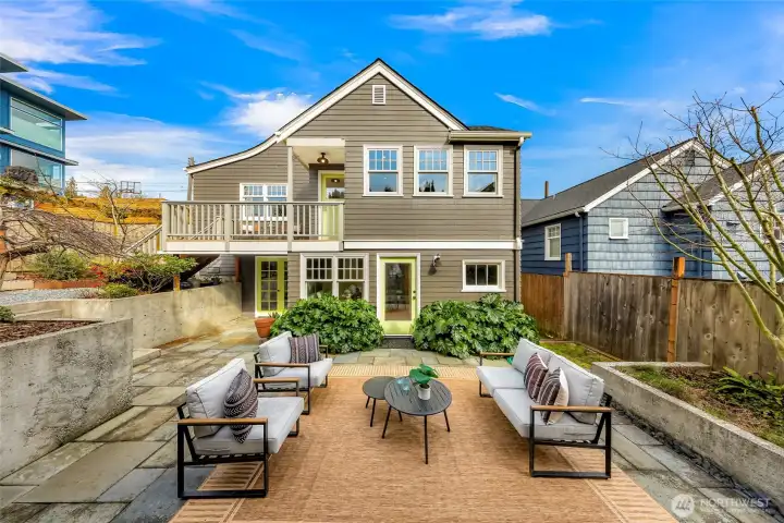 Beautiful backyard with patio and garden spaces. Irrigation installed for efficient watering.