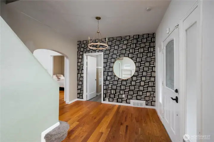 Another view of entryway and stairway. Guest bathroom is through the door.