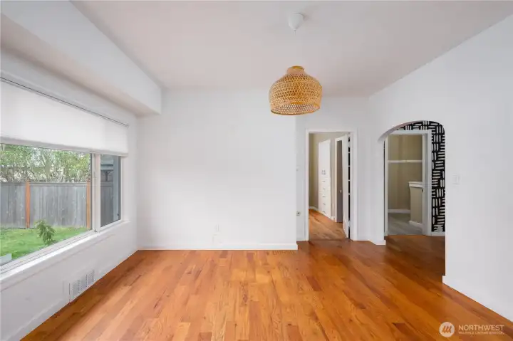 Large dining room with window overlooking the backyard.