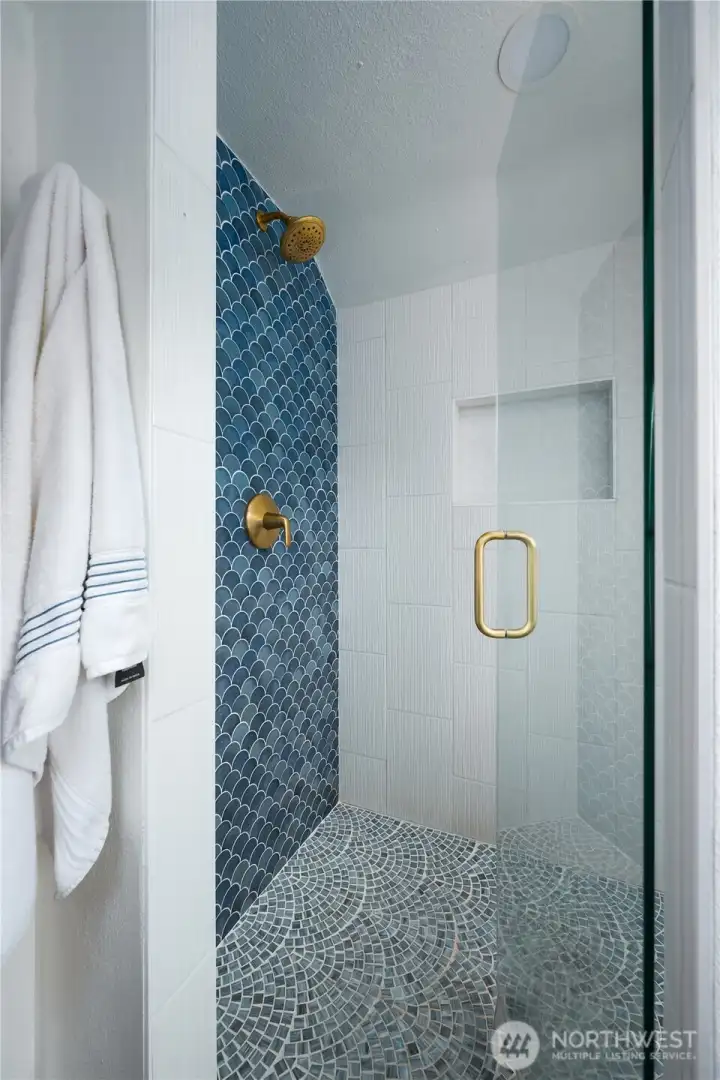 Intricate tile work in the added shower!