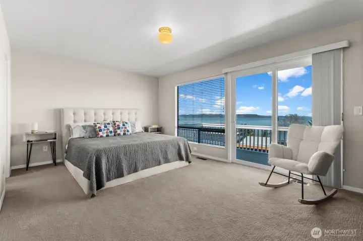 Primary suite at the opposite end of the home with balcony access
