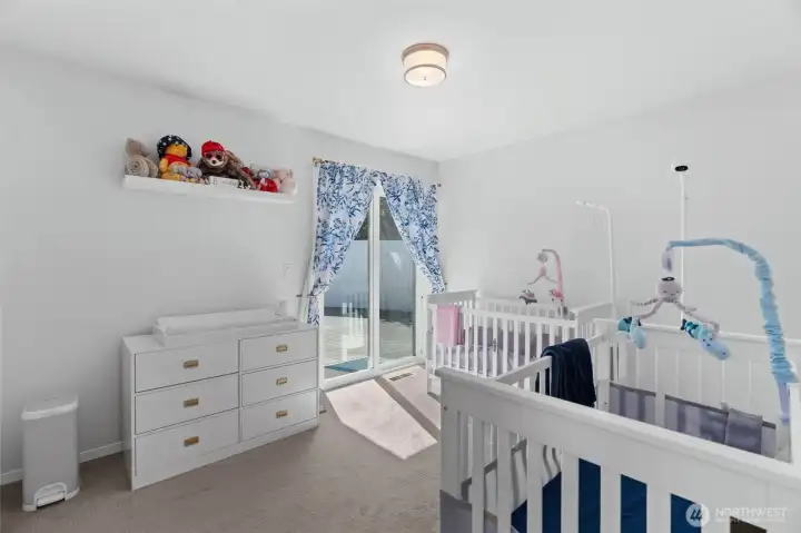 Second bedroom with sliding door access to the back patio