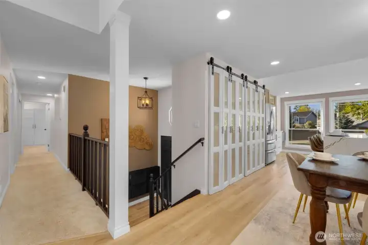 Abundant natural light fills the main floor, enhanced by surrounding windows