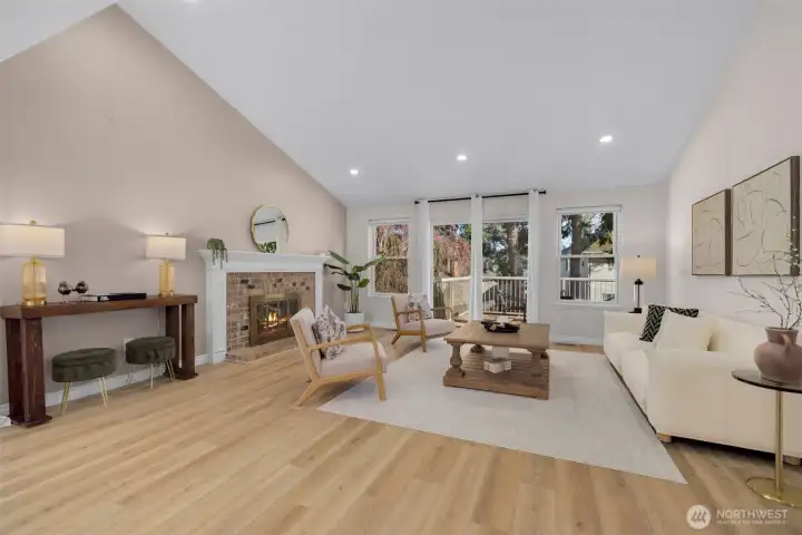 Soaring vaulted ceilings with exposed beams create a striking, elevated presence and seamless flow into the main family room