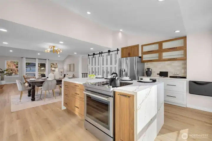 Intentional design with spice rack and pull-out trash cabinet placement