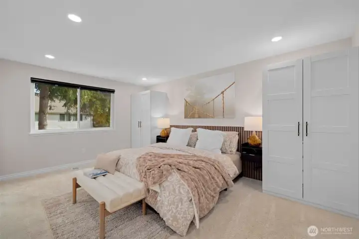 Primary bedroom is spacious and offers additional closet space