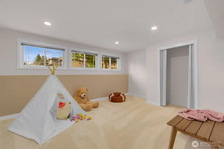 Spacious bedroom #5 on the lower level! Staged here as kids room- enjoy this space for guest room, work-out area, studio and more!