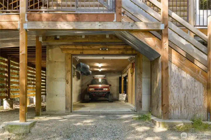 Lower garage entry with access to main floor living through inside the garage or outside steps. The inside option is so nice in the winter. See track vehicle that makes it easy to get to this darling cabin in the winter. Tracked vehicle is for sale as well.