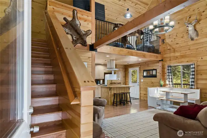 Once you enter this adorable cabin you have the choice of staying on the main floor or take the stairs up for additional living areas.