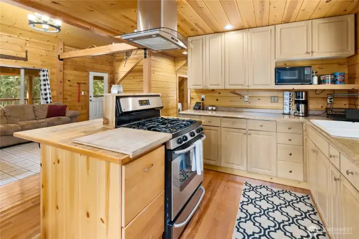 View of this beautiful kitchen. Look at all the counter space and room for others to help make those amazing meals.