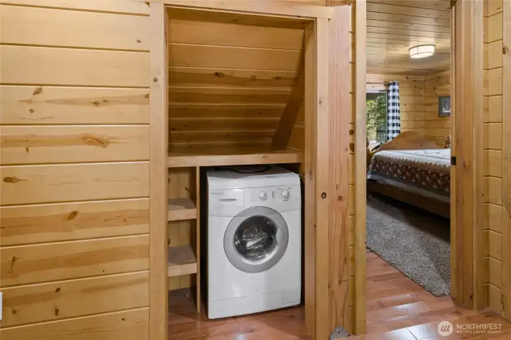Main floor washer and dryer combo unit. Just outside the bedrooms.