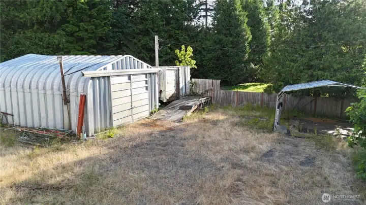 Shop with 2 storage trailers plus another car port