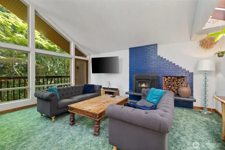 Living room, with cozy wood burning wood insert.