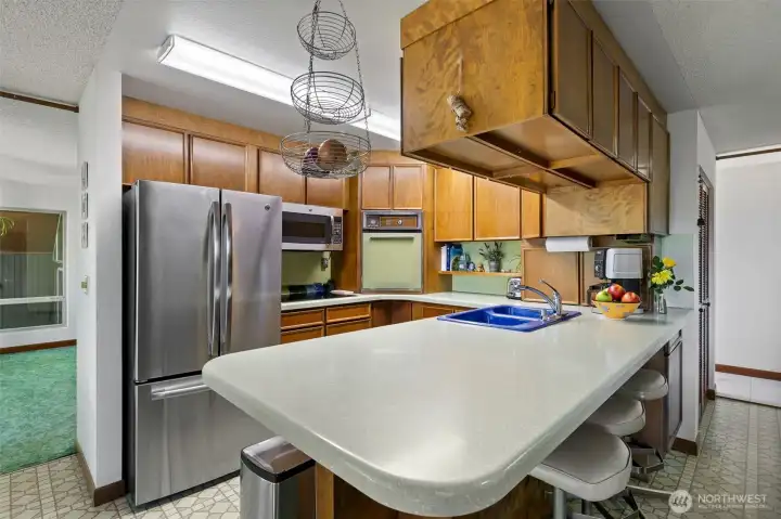 Kitchen with Wolf Induction Stovetop and SS Refrigerator
