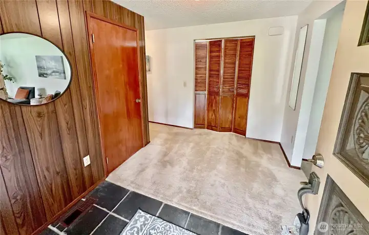 Front entry with slate floor...great floor plan with good traffic flow.  From the entry you access to the living room, family room and bedrooms.