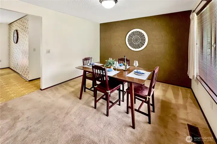 In this photo you see the access to the breakfast nook and hall to the garage from the dining room.