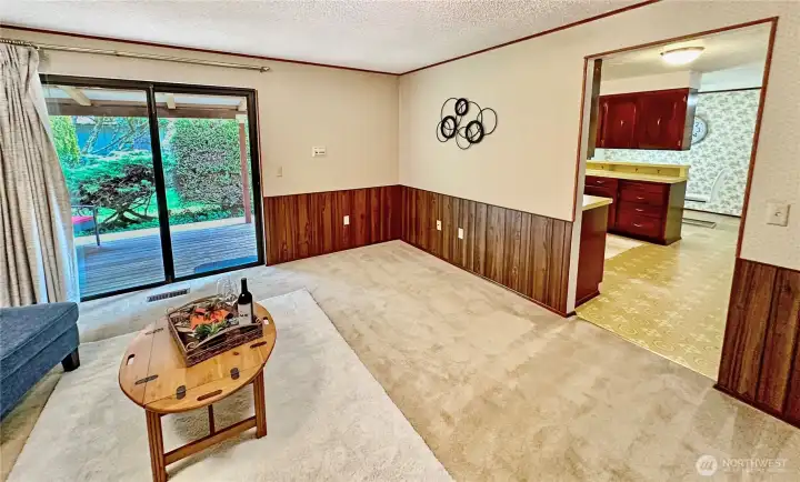 The family room offers good wall space for your large TV and easy access to the kitchen and backyard.