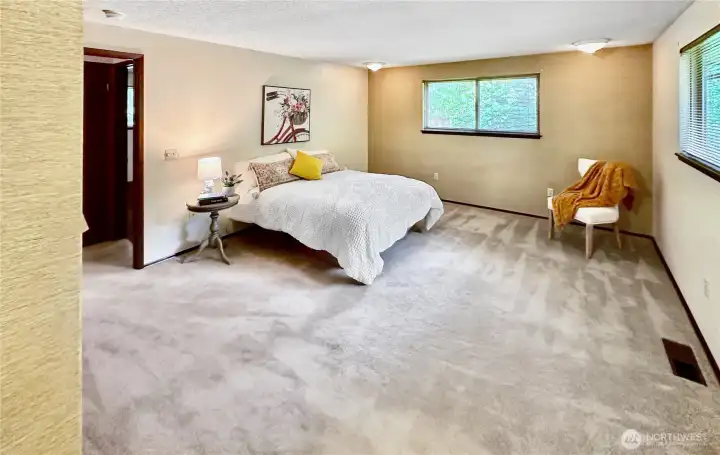 Spacious ample primary bedroom with private full bath.