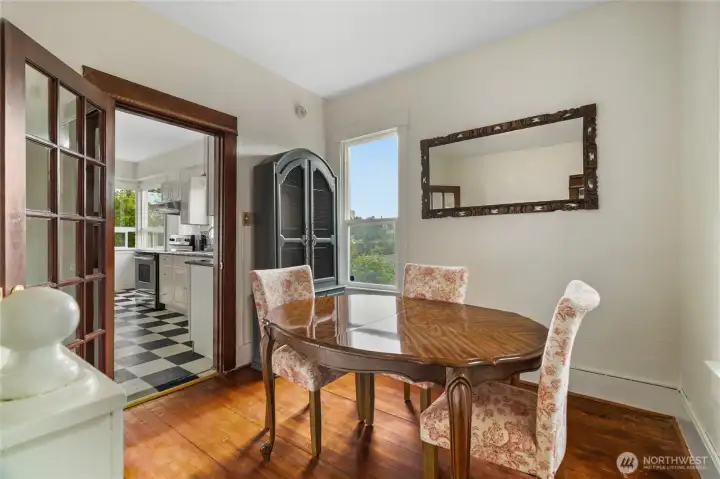 Features a highly functional, sun-lit dining room located directly off the kitchen.  Previously a 3rd bedroom closet remains and has direct access to main bath.  Staircase connects to lower level.  Take note of the close grain on wood floor.
