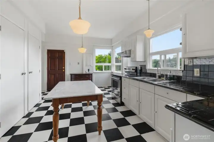 Two reach in pantry closets add to the functionality of the bright and cheery kitchen.  An exterior door brings you to covered deck/porch.