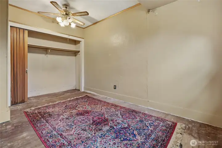 High ceilings for generous closest space.  Floors have been protected over the years and will refinish beautifully.