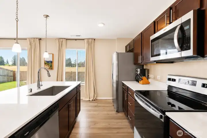 large island and stainless steel appliances. large island and stainless steel appliances.