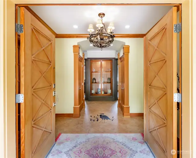 Grand entry with rich fir doors and moldings