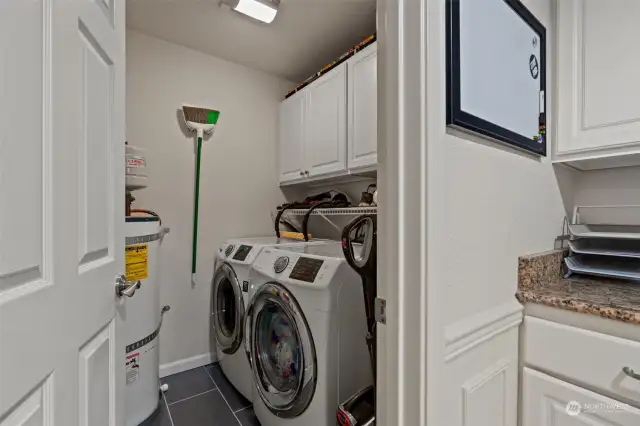 Huge laundry room with more storage space.
