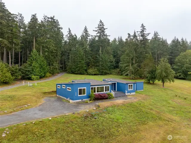 Aerial looking SW toward forested section of parcel