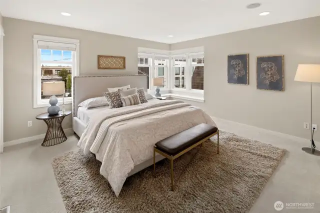 Retreat to your calm and spacious sanctuary—this sun-drenched primary suite offers plenty of room to unwind in comfort and style.
