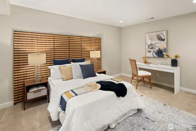 Tucked away for quiet and privacy, the lower-level bedroom is generous in size and big on options — think guest room, gym, or media zone.
