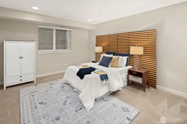 This lower-level retreat doubles as a peaceful workspace or creative corner—with room for productivity and rest in equal measure. Armoire conveys.