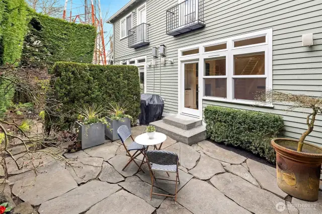 Step out to this private, fully fenced patio—perfect for morning coffee, summer grilling, or evenings under string lights.