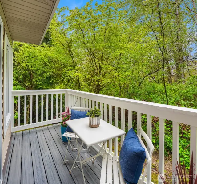 Private deck off the main living area surrounded by nature.