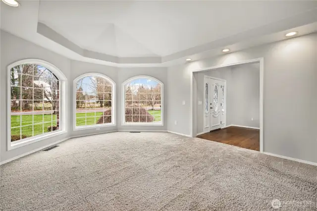 Formal living room with lots of natural light