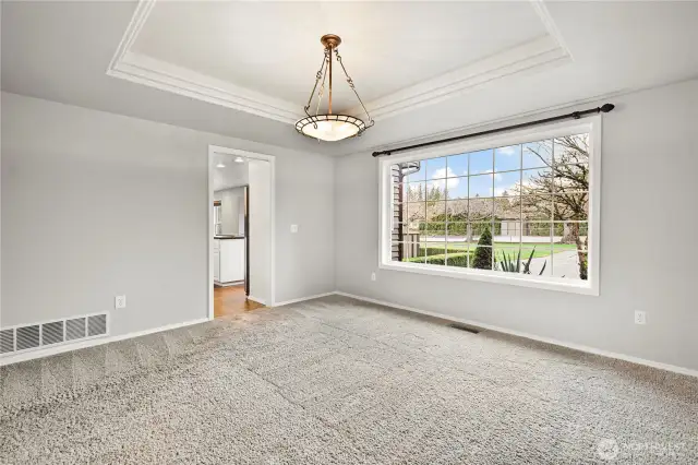 Dining room with view of sports court and back yard