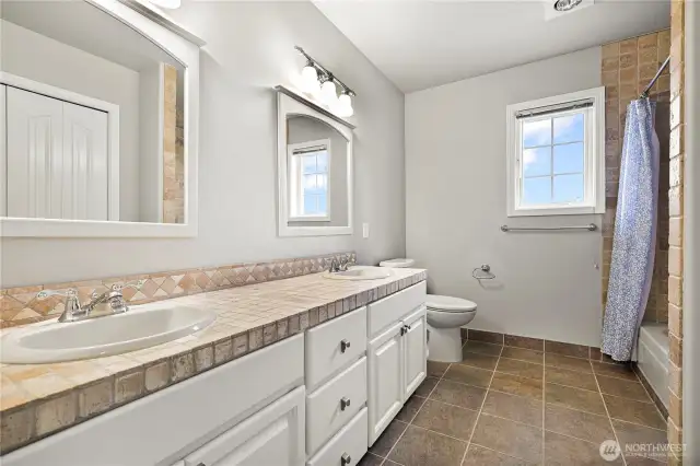 Full bath with double sinks