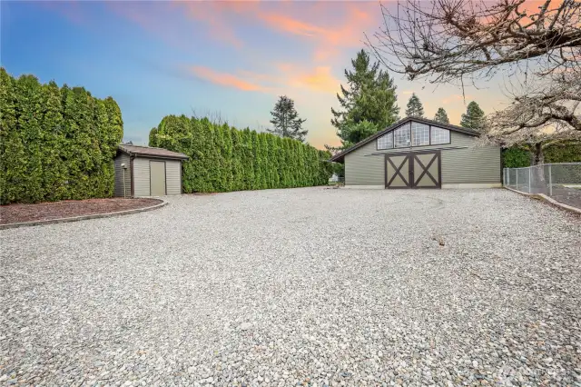 large gravel turnaround with shared well house