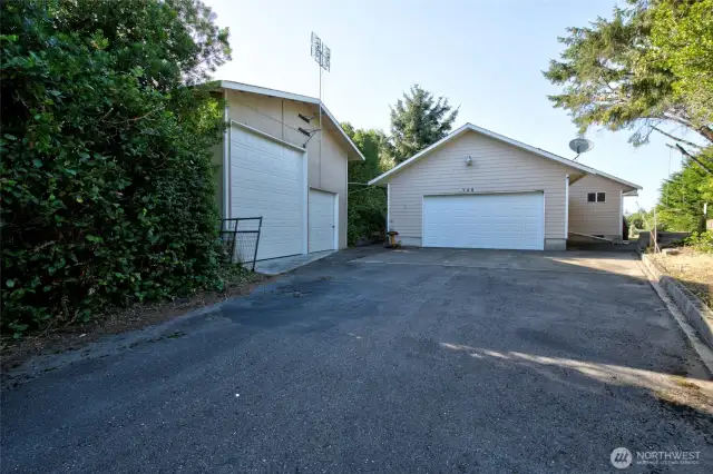 2 car attached garage and a detached RV garage and shop. Plus an extra lot.