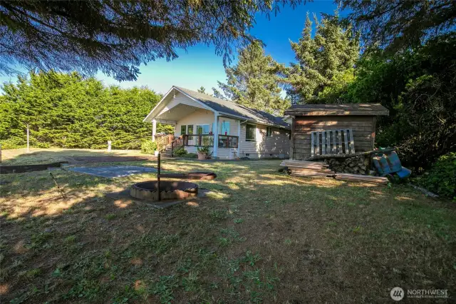 Home, large shed, extra lot and a fire pit for your smores.