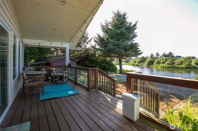 This covered porch allows for additional outdoor entertaining space.