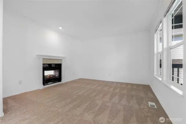 Front room with double-sided gas fireplace
