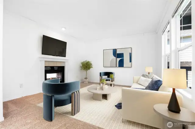 Virtually staged. Front room with double-sided gas fireplace.