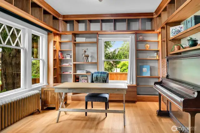 Original study/office has been upgraded with built-ins that match the kitchen. Since there's already a 3/4 bathroom on the main level, this could also make a lovely guest room.