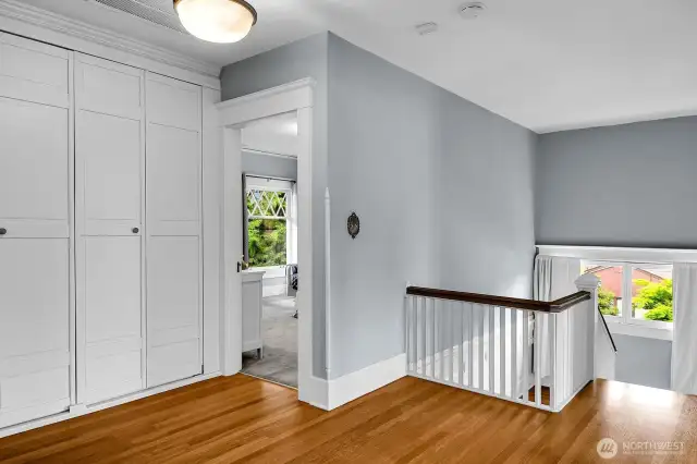 The landing leads to a large bedroom in each of the 4 corners of the upper level, hence the term Foursquare home. Each of the bedrooms have these same oak floors under the carpet.
