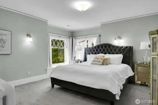 The primary bedroom has its own window seats and direct access to the luxurious full bathroom.