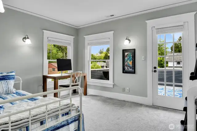 The NW corner bedroom has its own sunny deck.