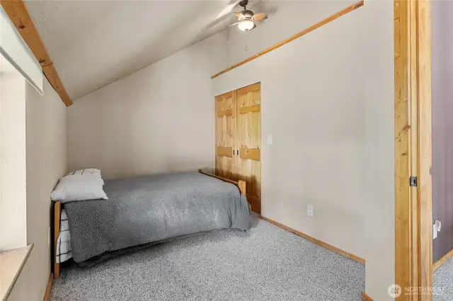 Upstairs bedroom 1- beautiful wood doors on the large closet!